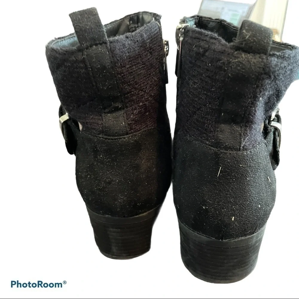 Women’s black ankle boots with buckle accents
